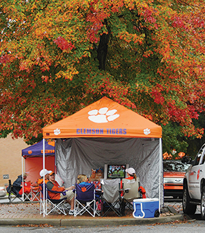 You'll find all the comforts of home in some tailgating tents, including TVs to keep up with the day's scores.