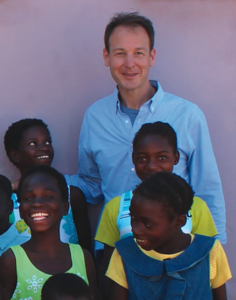 Joseph Mizzi ’88, with children in Zambia, where construction began this spring on Chipakata Children’s Academy.