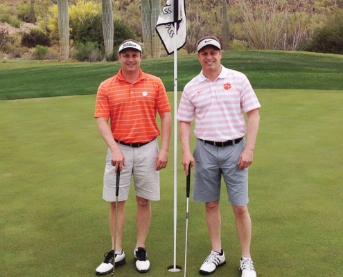 Arizona Todd ’85 and Jeff ’85 Taylor sport Tiger pride at Starr Pass Golf Club in Tucson.