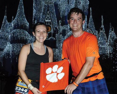 Florida Ginny Ahalt ’11 and Michael Quandt ’11 show their Tiger Rag at mile six of the 2015 Walt Disney World Marathon in Orlando.