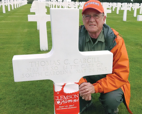 Netherlands David Lyle ’68, M ’79 honored fallen Clemson alumni with Tiger Rags at the Netherlands American Military Cemetery.