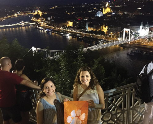 Hungary Stephanie Beard M ’14 and Sarah Worachek ’07 wave their Tiger Rag over Budapest at the Citadalla.