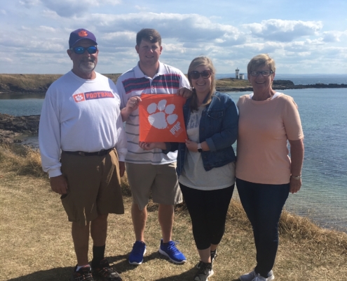 Scotland: Erica Harper ’13, M ’16 and Lucas Harper ’17 with Lucas’ parents, Eric and Lyn Harper, in Leven, Fife, a seaside town in Scotland.