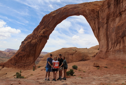 Utah: Tom M ’91, Nancy ’81, Pearson ’18 and Laura ’18 Mann at Corona Arch, a sandstone arch near the Colorado River, during a family trip.