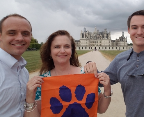 France: Elizabeth Milam ’87, M ’88 with her sons, Carson Lomas, a first lieutenant in the U.S. Air Force, and Turner Lomas ’20, at the Chateau de Chambord. Milam, director of student financial aid, celebrated her 30th year working at the University in Dec. 2018.