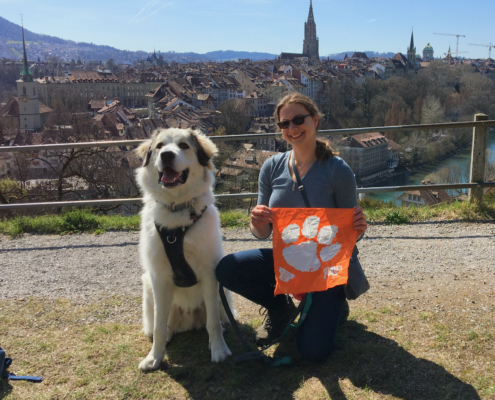 Switzerland: Jessica Baron M ’18, a Ph.D. candidate in computer science, visual computing, is abroad in Switzerland for most of 2021 on a Swiss/Fulbright award at EPFL focused on researching feather appearance in computer graphics. Her companion, Fresnel the Great Pyrenees, is now a world traveler, too! This photo was taken in the Swiss capital of Bern.
