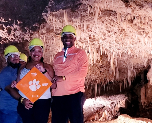 Barbados: John J. Evans ’01, M ’03, Ph.D. ’18, Paulette J. Evans, ’01, Ed.D. ’21 and Rondell A. Lee ’05 ventured into Harrison’s Cave, a limestone cave in the parish of St. Thomas, on their trip to Barbados.