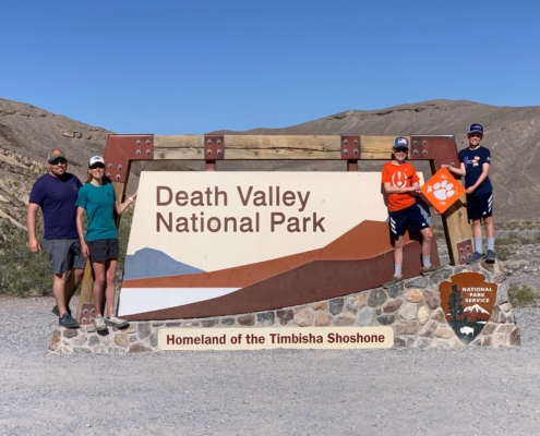 Matt ’01, M ’02 and Jessica Cummings ’01, M ’03 Bolin enjoy taking their two sons to national parks. A recent stop at Death Valley National Park for Spring Break 2022 was especially memorable for these four Clemson Football fans.